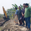 বড়াইগ্রামে ৮'শ বিঘা জমি রক্ষায় এসি ল্যান্ডের উদ্যোগে বাঁধ অপসারণ