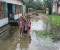 হাঁটু পানিতে ডুবে আছে গ্রাম, ঘরবাড়ি থেকে বিদ্যালয় এমনকি কবরস্থানও 